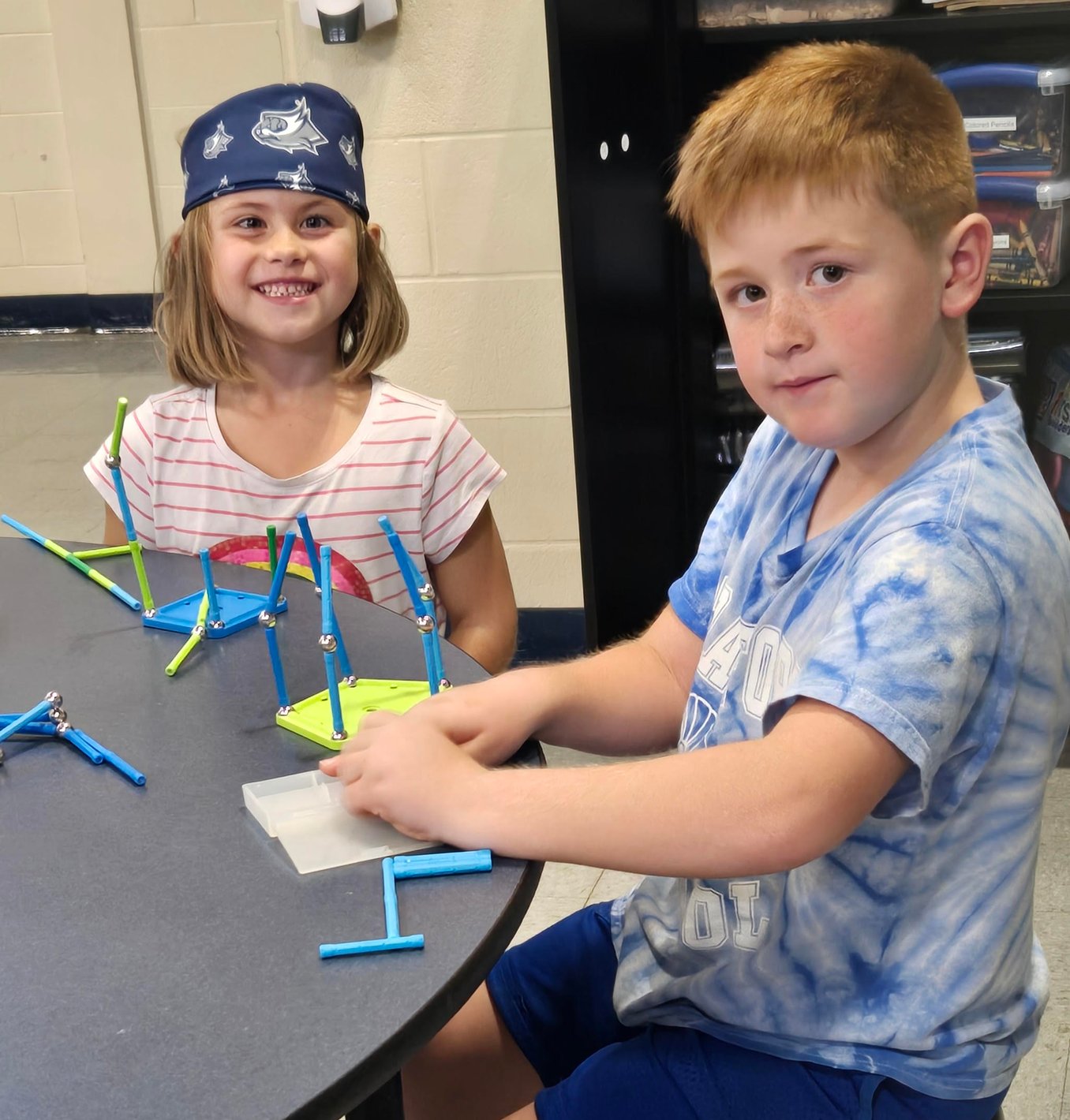 Teacher helping student